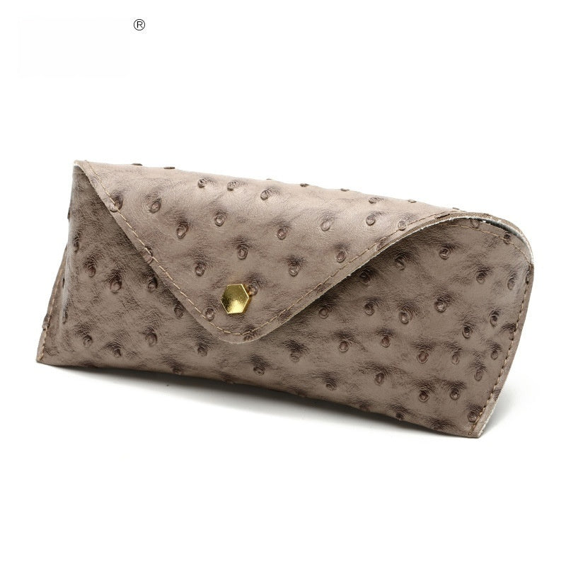 Khaki polka dot leather sunglasses case with curved flap and gold-tone clasp