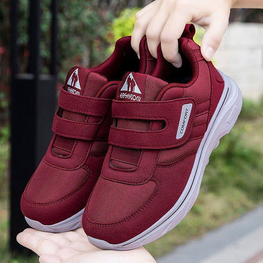 Purplish red lightweight casual sneakers with hook-and-loop straps and white outsole
