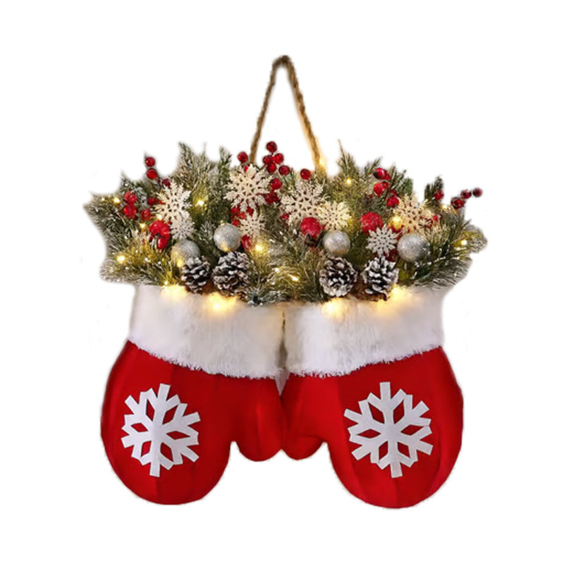 Hanging Christmas glove ornaments: red snowflake gloves with white trim and evergreen wreath