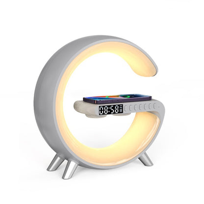Gray G-shaped lamp with warm LED lighting, digital clock and wireless phone charging pad