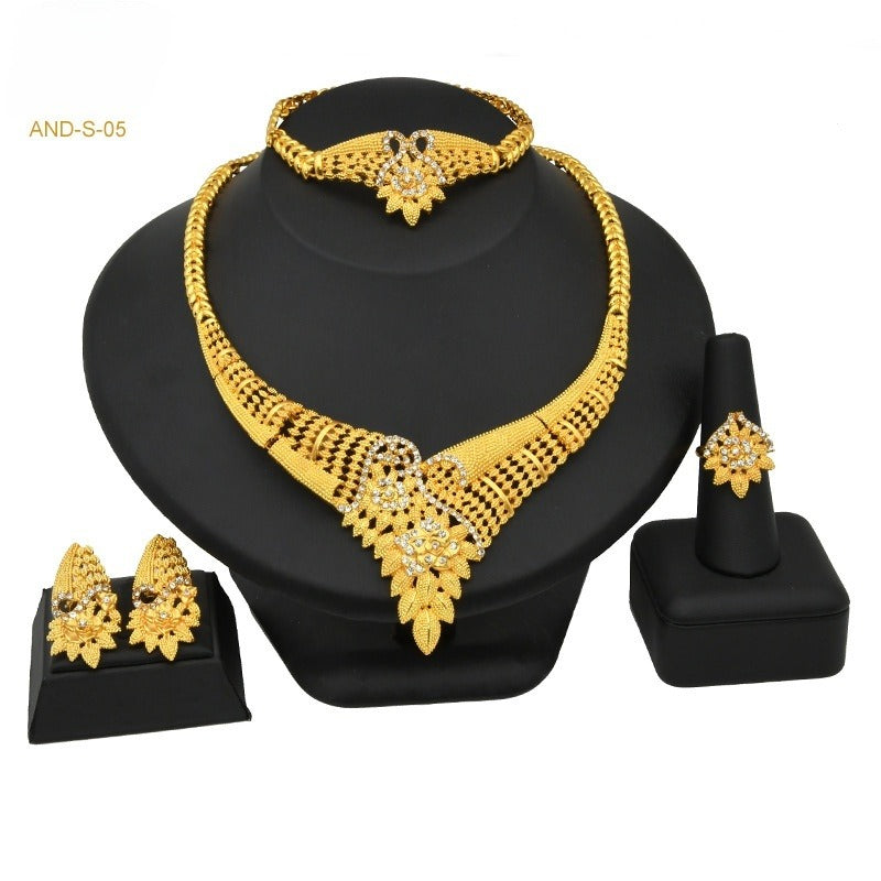 Gold-plated beaded necklace set with matching bracelet, drop earrings, and ring