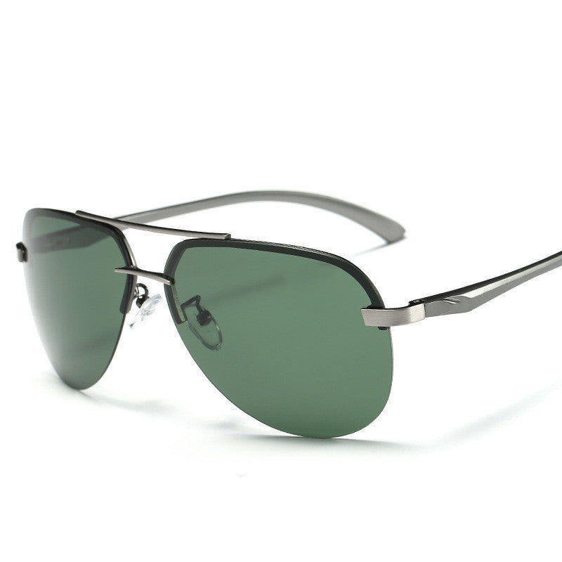 Sunglasses with green lenses and silver frame on a white background