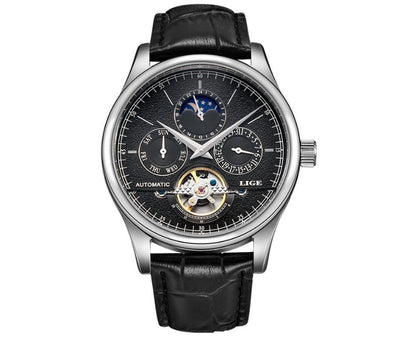 Luxury watch with black leather strap and detailed face on a white background