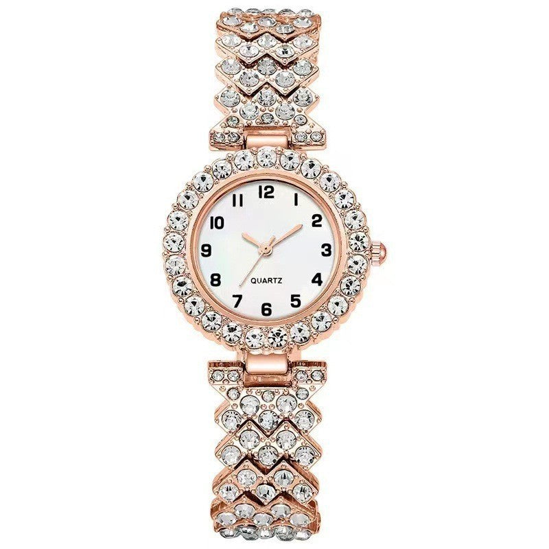 Rose-gold-tone rhinestone-style watch with white dial and heart-link band