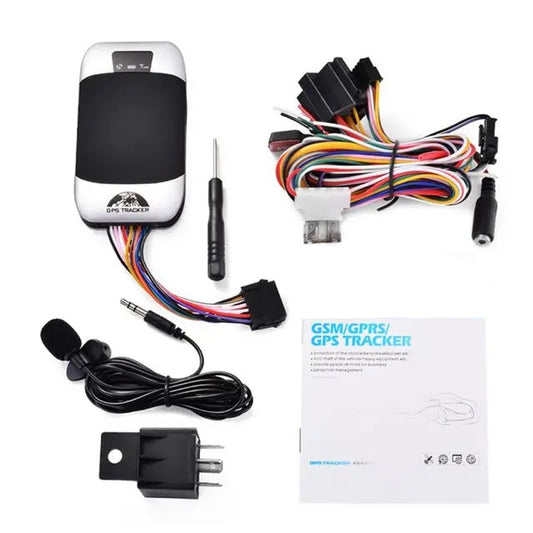 GSM/GPS tracker with accessories on a white background