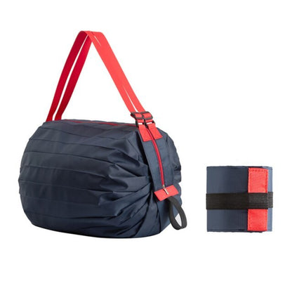 Navy bag with red straps and a matching wrist wrap on a white background