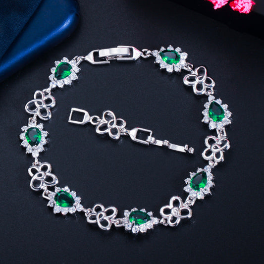 18K gold-plated zircon bracelet with green and clear gemstone links, hinged clasp
