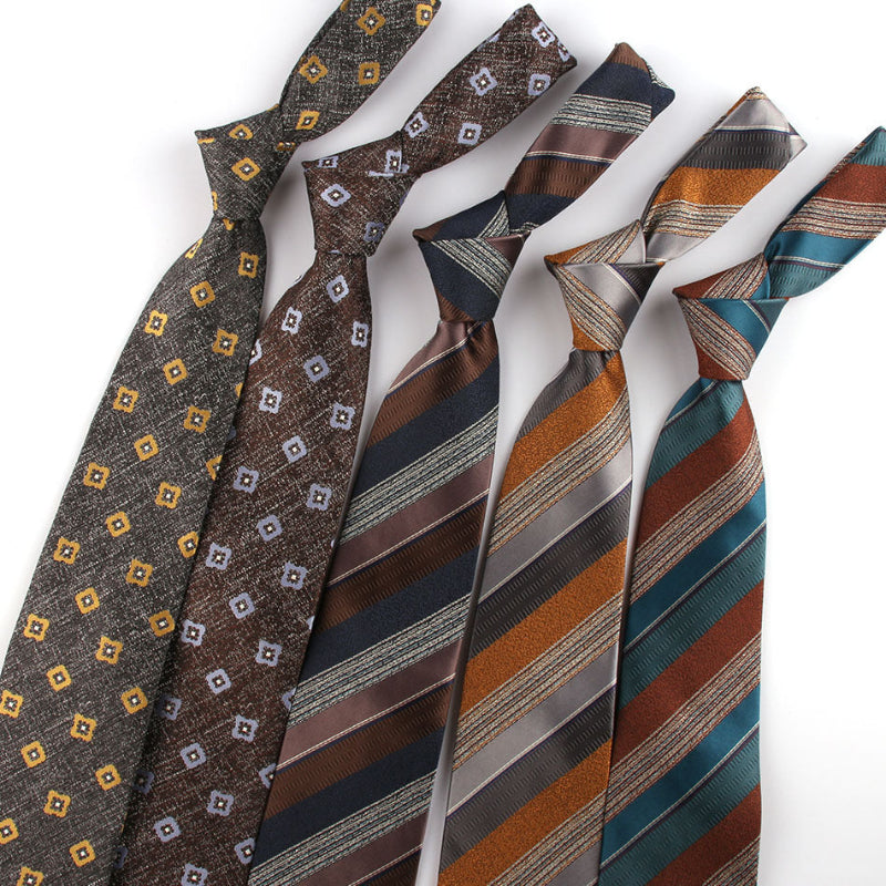 Collection of patterned ties on a white background