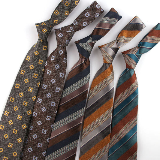 Collection of patterned ties on a white background