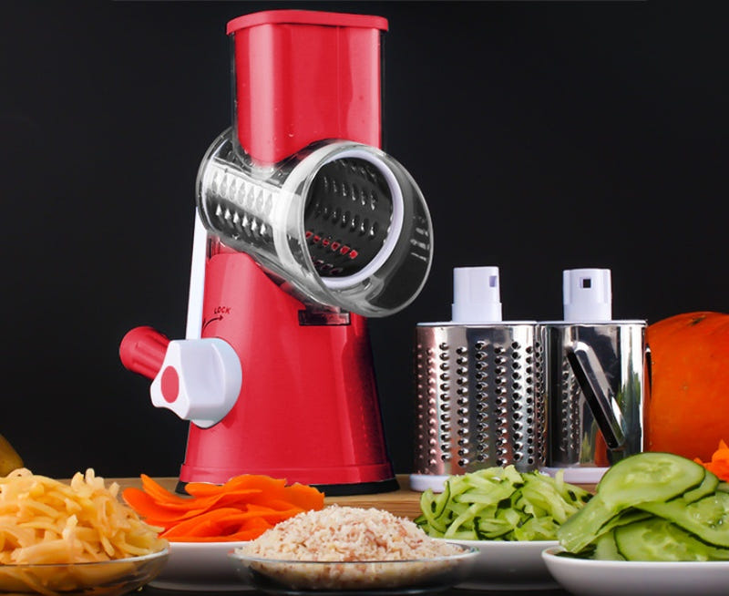 Red rotary vegetable slicer with stainless grating drum and safety handle