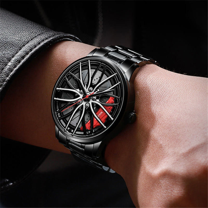 Black men’s quartz wristwatch on wrist; round racing wheel dial with red accents