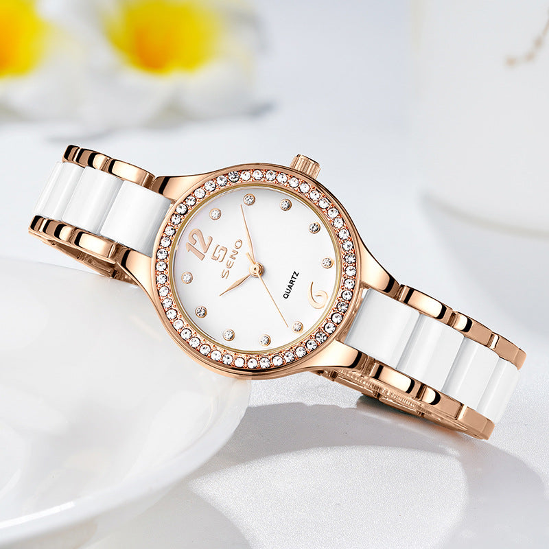 Rose gold and white watch with floral background