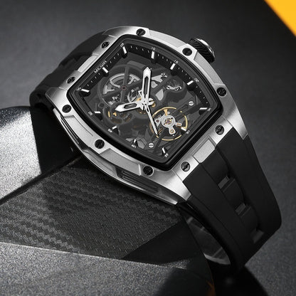 Luxury watch with black strap and transparent face on a dark background