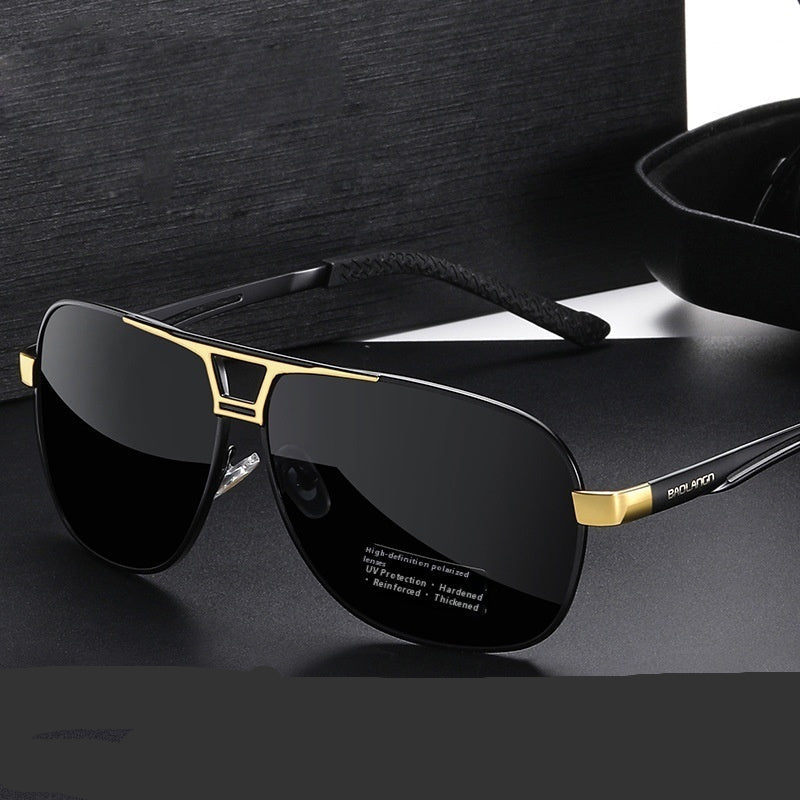 Polarized sunglasses with black lenses and gold accents, side logo on temple