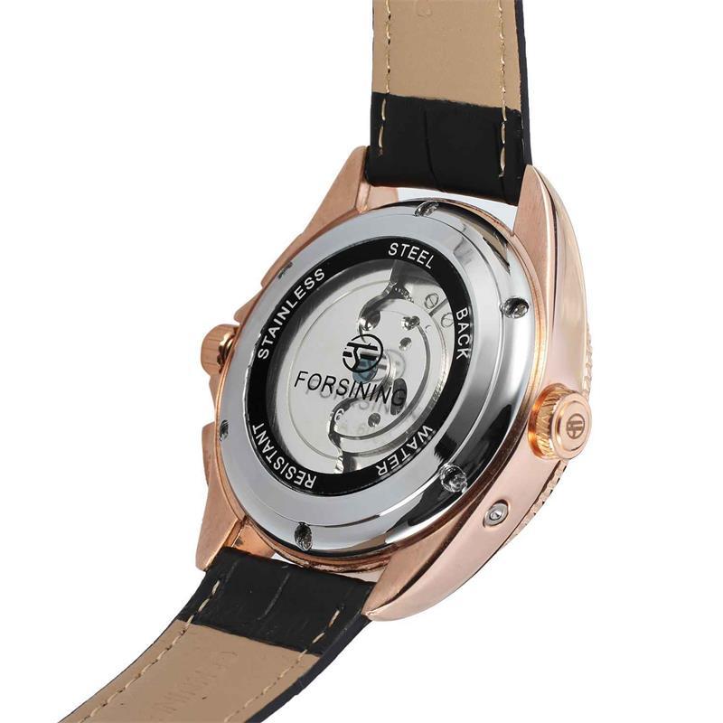 Watch with black strap and rose gold case on a white background