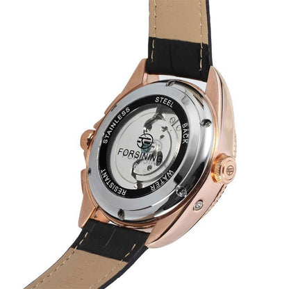 Watch with black strap and rose gold case on a white background
