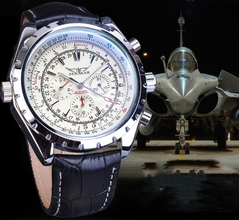 Luxury watch with detailed face and leather strap in front of a fighter jet
