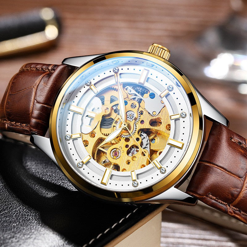 Luxury watch with brown leather strap and gold and silver case on a wooden surface