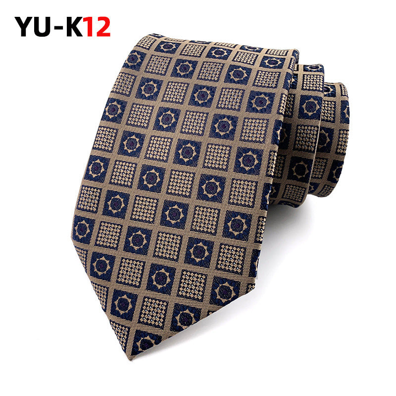 Patterned tie with geometric design on a white background, featuring the brand 'YU-K12'.