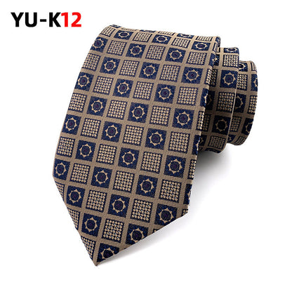 Patterned tie with geometric design on a white background, featuring the brand 'YU-K12'.