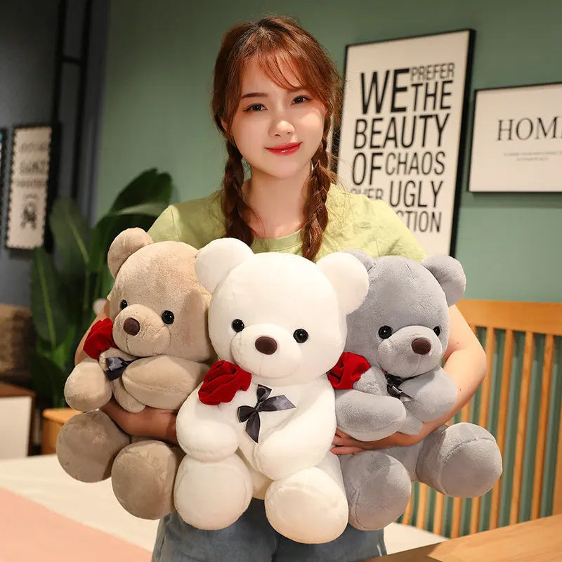 Woman holding three teddy bears of different colors. YAXSO UAE ONLINE STORE