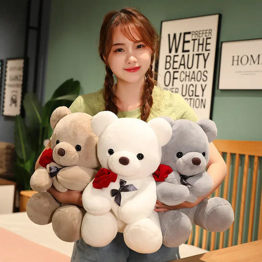 Woman holding three teddy bears of different colors. YAXSO UAE ONLINE STORE