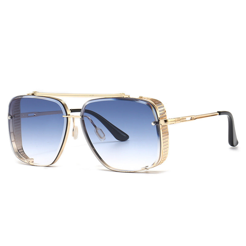 Oversized square sunglasses with blue mirrored lenses and gold-tone frame