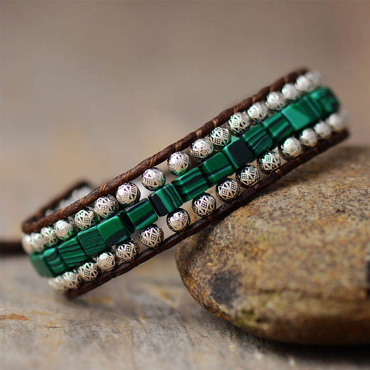 Green and white stone beaded bracelet with brown leather wrap and silver-tone beads