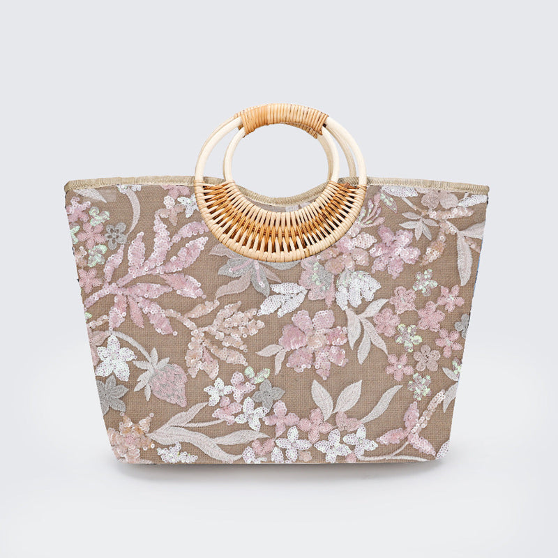 Large woven cotton tote bag with floral lace pattern and woven rattan top handles, taupe and pink