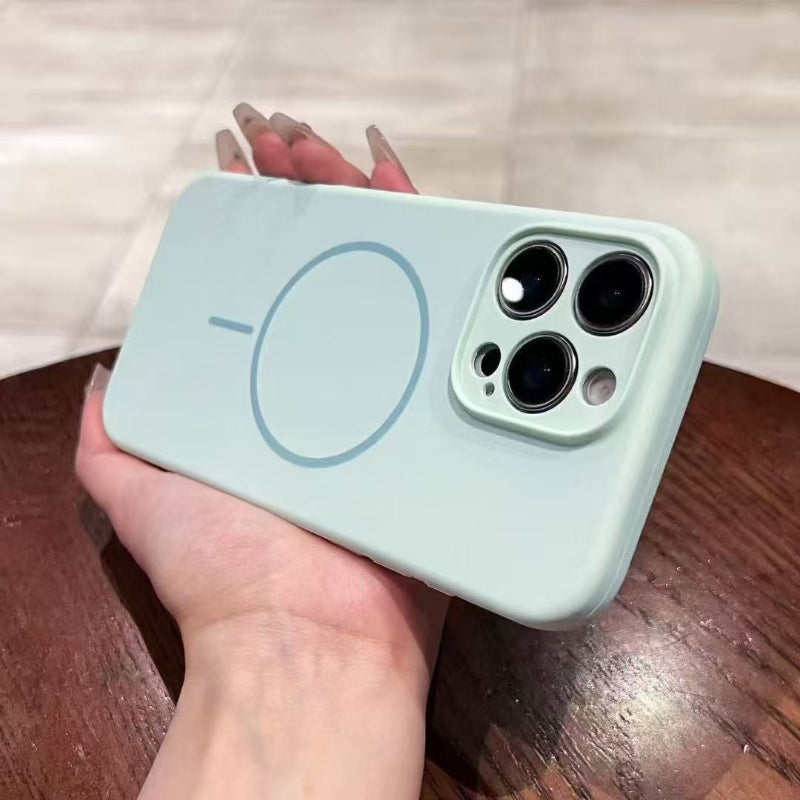 Light blue phone case held by a hand on a wooden surface