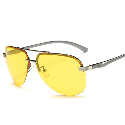 Sunglasses with yellow lenses and silver frames on a white background