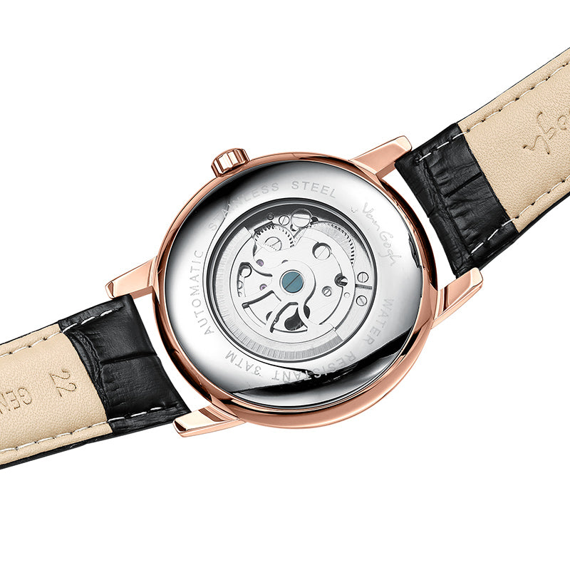 Men's watch caseback with black leather strap, rose gold-tone bezel, exposed movement