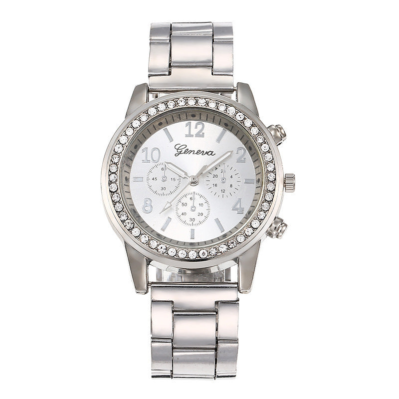 Silver wristwatch with gemstone accents on a white background