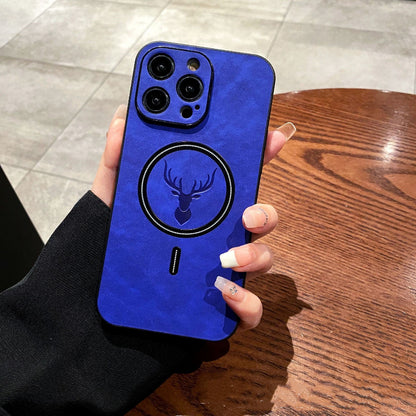 Blue phone case with a deer emblem held by a person on a wooden table.