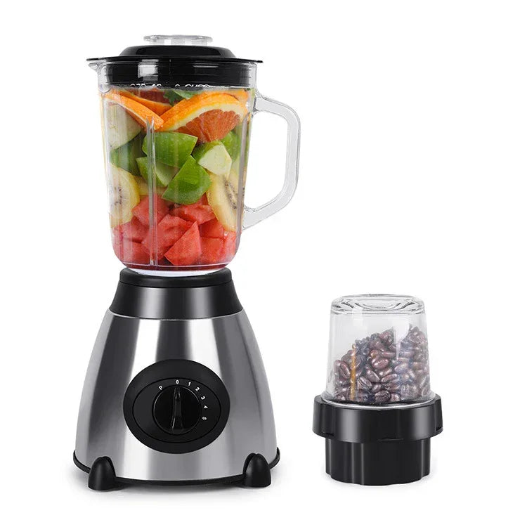 Household multifunction grinder and juicer with fruit-filled clear jug and small grinder cup