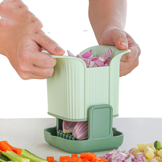 Person using a green vegetable chopper to slice onions on a white background