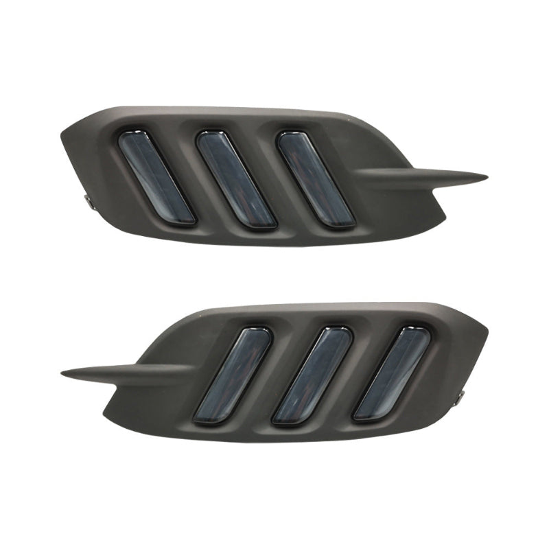Pair of rear bumper signal light housings with dark gray lenses