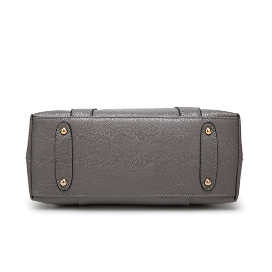 Gray handbag with gold accents on a white background