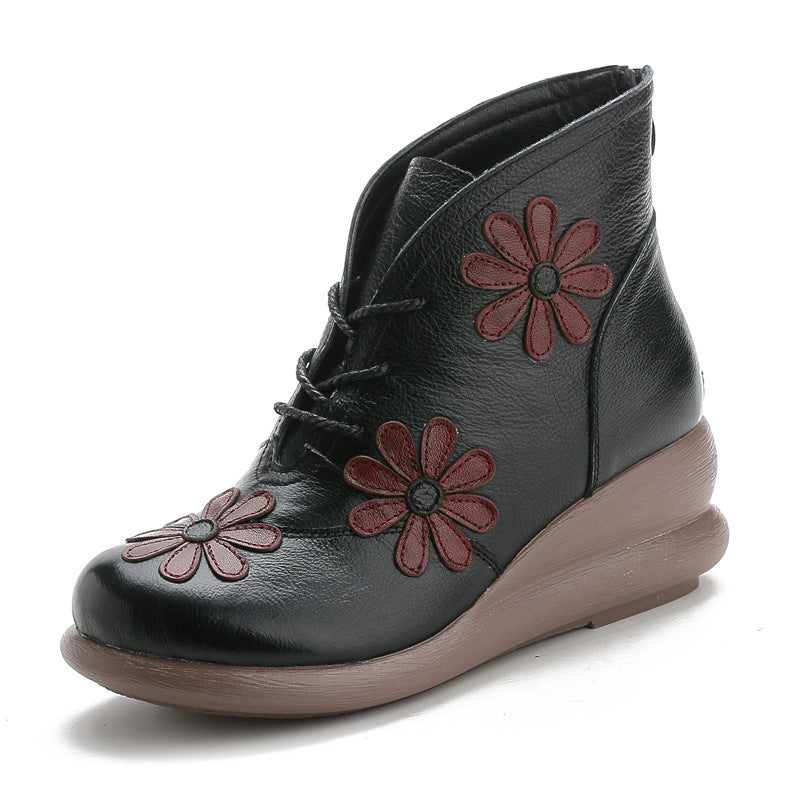 Black mid-top leather ankle boot with lace-up and red flower appliques