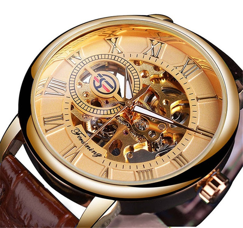 Gold wristwatch with visible mechanical components on a white background