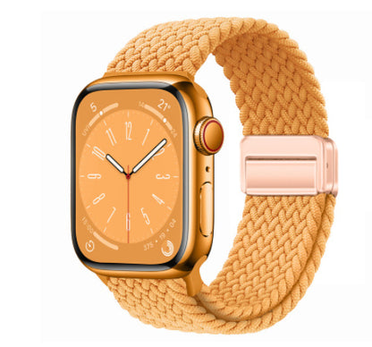 Smartwatch with a gold band on a white background