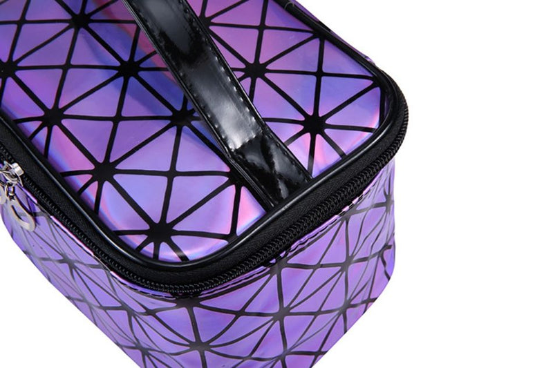 Purple holographic cosmetic bag with black zipper and geometric pattern close-up