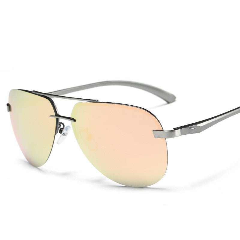 Sunglasses with gold-tinted lenses and silver frame on a white background
