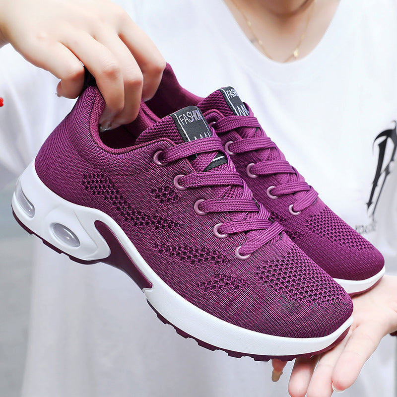 Purple lace-up knit running shoe with white air-cushion sole, breathable mesh upper