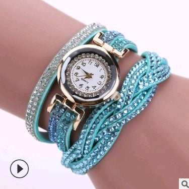 Women’s diamond twisted bracelet quartz watch with aqua jeweled strap