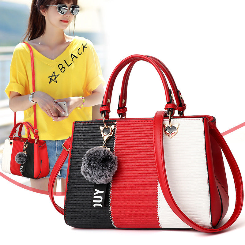 Red, black, and white color-block PU leather crossbody handbag with pompom charm