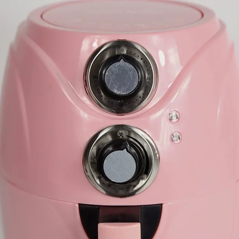 Pink air fryer close-up of two dial controls with numbered markings.