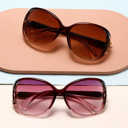 Two pairs of sunglasses with brown and pink lenses on a light blue and beige background.