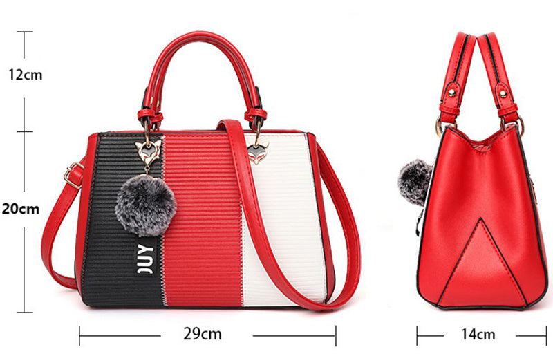 Red, black, and white color-block handbag with top handles and long crossbody strap