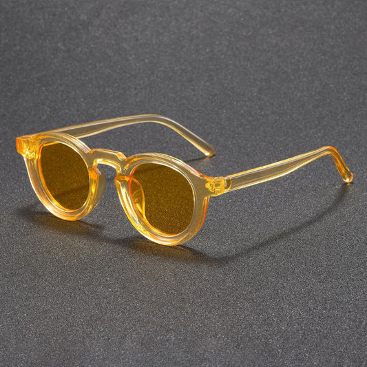 Yellow sunglasses on a gray textured background